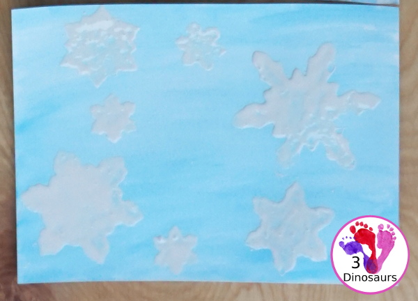 Snowflake Q-Tip Painting - a fun mixed art project that kids can do to paint snowflakes - 3Dinosaurs.com