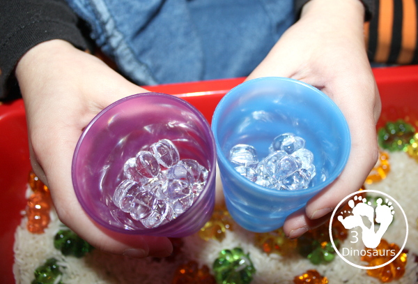 Pumpkin rice Sensory Bin - a simple rice sensory bin with pumpkins for a small sensory play for October and November - 3Dinosaurs.com