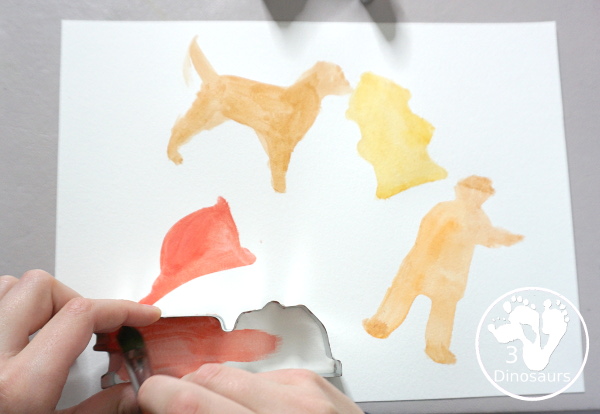 Fire Safety Cookie Cutter Watercolor Painting - a super simple painting activity you can do with kids of different ages. It is a great way to explore the different shapes that are in the cookie cutter sets - 3Dinosaurs.com