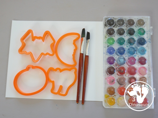  Halloween Watercolor Cookie Cutter Painting - a simple Halloween painting with watercolors and cookie cutters. An easy Halloween painting for kids. 3Dinosaurs.com