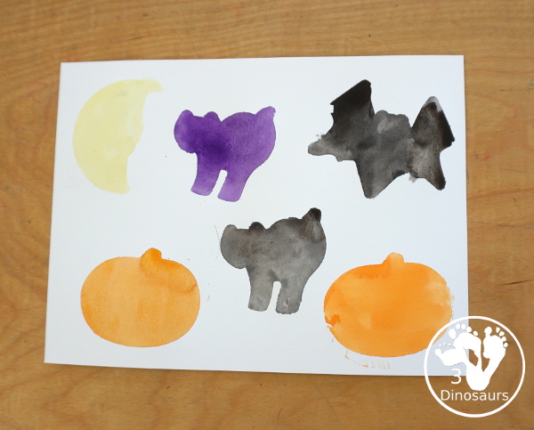  Halloween Watercolor Cookie Cutter Painting - a simple Halloween painting with watercolors and cookie cutters. An easy Halloween painting for kids. 3Dinosaurs.com