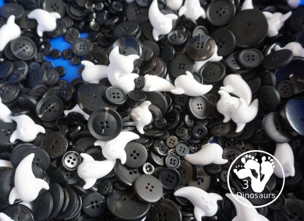 Ghost Button Sensory Bin - a simple sensory bin with ghost and black buttons for the filler. A fun Halloween sensory bin for kids. - 3Dinosaurs.com