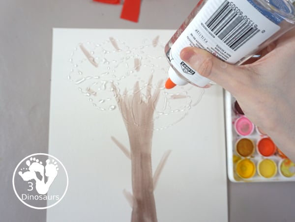 Tissue Paper Fall Tree Craft - a fun mixed art craft with a watercolor tree and then the fall leaves with tissue paper. A simple and easy fall craft to make with kids. - 3Dinosaurs.com