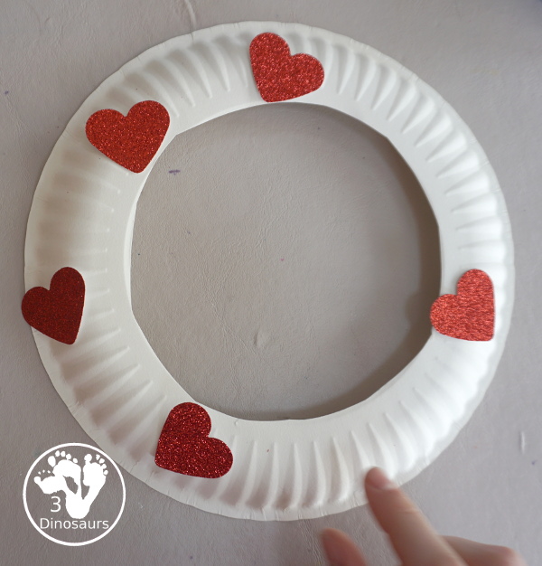 Rainbow Heart Wreath - made with glitter hearts and a paper plate that is super simple to put together for heart theme of Valentines - 3Dinosaurs.com