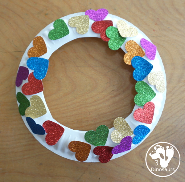 Rainbow Heart Wreath - made with glitter hearts and a paper plate that is super simple to put together for heart theme of Valentines - 3Dinosaurs.com