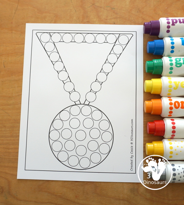 Free Medal Fine Motor Mat Printables - you have four fine motor mats with medal tracing page, medal template printable, q-tip medal page, and a medal dot marker page. Great for any theme with a medal or for the Olympics - 3Dinosaurs.com