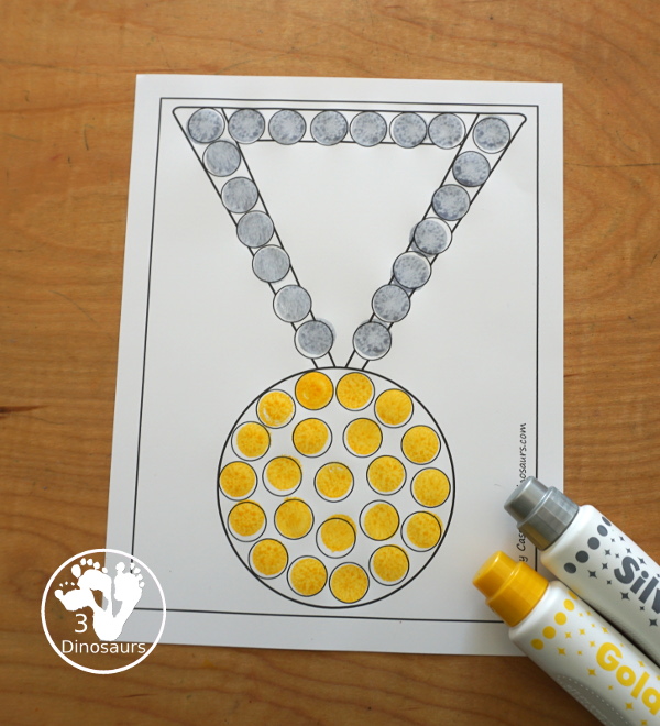 Free Medal Fine Motor Mat Printables - you have four fine motor mats with medal tracing page, medal template printable, q-tip medal page, and a medal dot marker page. Great for any theme with a medal or for the Olympics - 3Dinosaurs.com