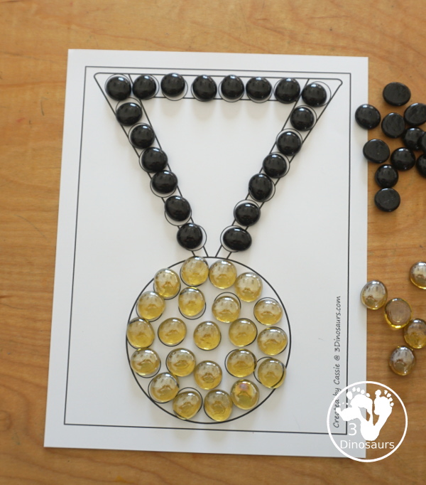 Free Medal Fine Motor Mat Printables - you have four fine motor mats with medal tracing page, medal template printable, q-tip medal page, and a medal dot marker page. Great for any theme with a medal or for the Olympics - 3Dinosaurs.com