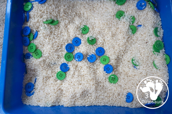 Blue & Green Button Sensory Bin for Earth Day -  you have a simple sensory bin with a rice filler with blue and green sensory bins.  - 3Dinosaurs.com