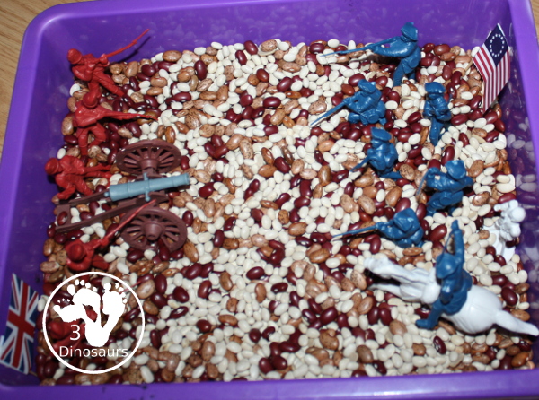 American Revolution Sensory Bin - a simple sensory bin made with beans and plastic figures for the American and British size of the war.  3Dinosaurs.com