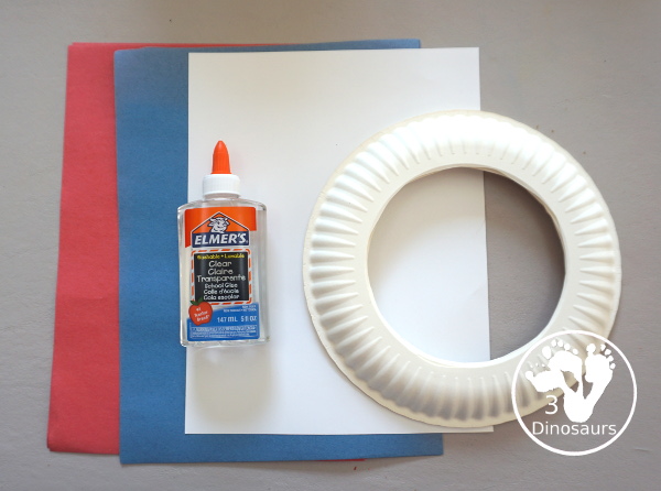Red, White, & Blue Torn Paper Wreath is a fun wreath you can make with kids. You use torn paper of red, white, and blue glued on the wreath. A simple idea for the Fourth of July for kids. 3Dinosaurs.com