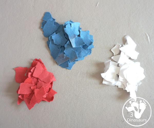 Red, White, & Blue Torn Paper Wreath is a fun wreath you can make with kids. You use torn paper of red, white, and blue glued on the wreath. A simple idea for the Fourth of July for kids. 3Dinosaurs.com