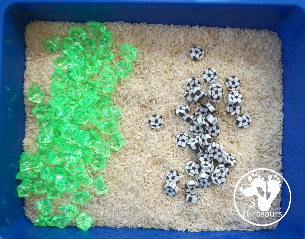 Soccer Sensory Bin - a simple sensory bin with rice filler with green rocks and soccer erasers for the parts of the sensory bin. A fun summer sport theme for kids. 3Dinosaurs.com