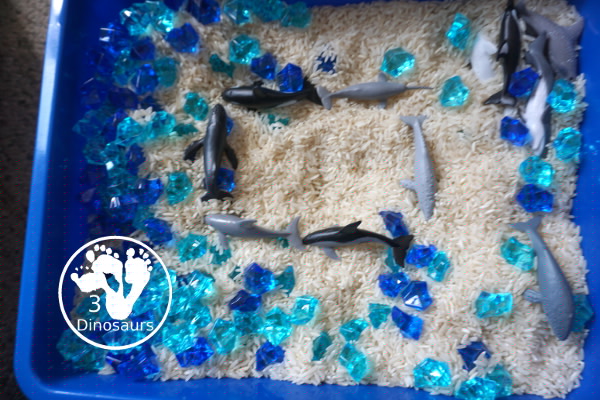 Dolphin and Whale Sensory Bin for kids - a simple sensory bin you can do for an ocean theme with kids. A great preschool and kindergarten age sensory bin for kids - 3Dinosaurs.com