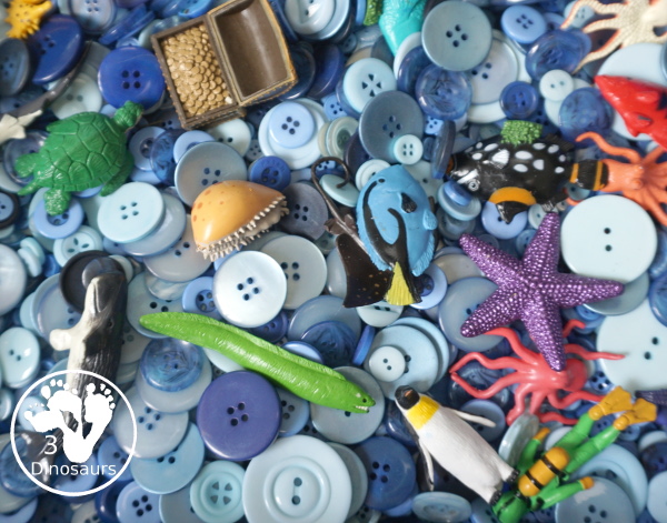 Ocean Button Sensory Bin - a simple and fun sensory bin with buttons for the filler and ocean animals, A great summer sensory bin that is easy to set up. - 3Dinosaurs.com