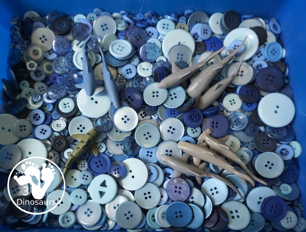 Shark Button Sensory Bin -a simple button sensory bin filler with different types of sharks in the sensory bin. A fun sensory play for shark week or any shark theme that you might be doing. - 3Dinosaurs.com