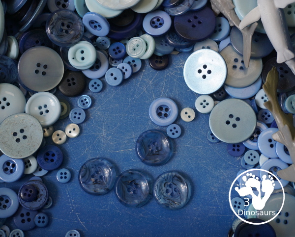 Shark Button Sensory Bin -a simple button sensory bin filler with different types of sharks in the sensory bin. A fun sensory play for shark week or any shark theme that you might be doing. - 3Dinosaurs.com