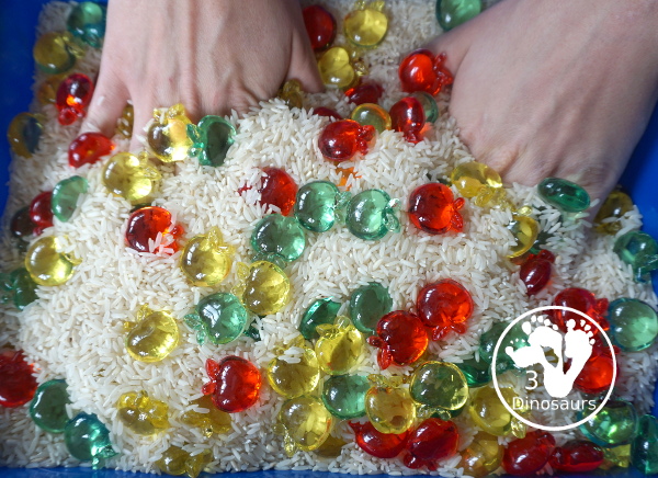 Simple Apple Sensory Bin - with acrylic apples and rice sensory bin. You have red apples, yellow apples, and green apples. This is a great sensory bin for the fall, and back to school. You can use it for any apple theme.  3Dinosaurs.com