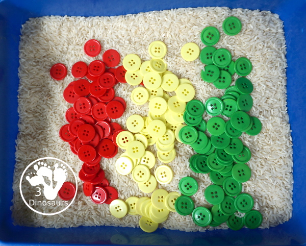 Red, Green & Yellow Button Sensory Bin. A fun button sensory bin that has the same color as apples. A fun fall sensory bin that is easy to set up and fun colors for kids. - 3Dinosaurs.com