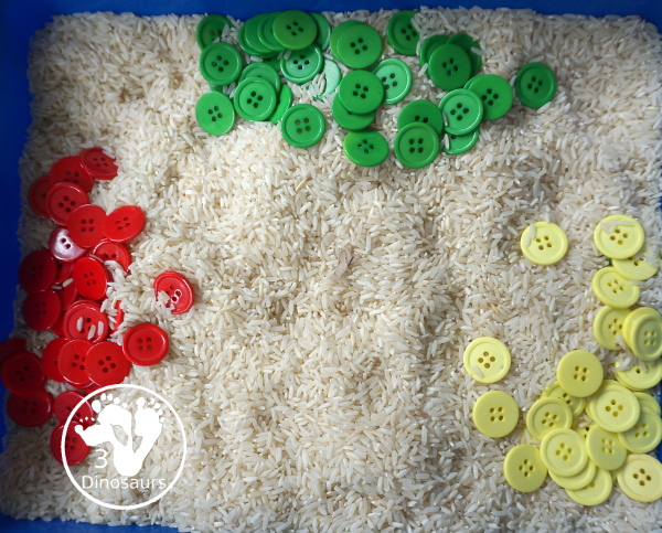 Red, Green & Yellow Button Sensory Bin. A fun button sensory bin that has the same color as apples. A fun fall sensory bin that is easy to set up and fun colors for kids. - 3Dinosaurs.com