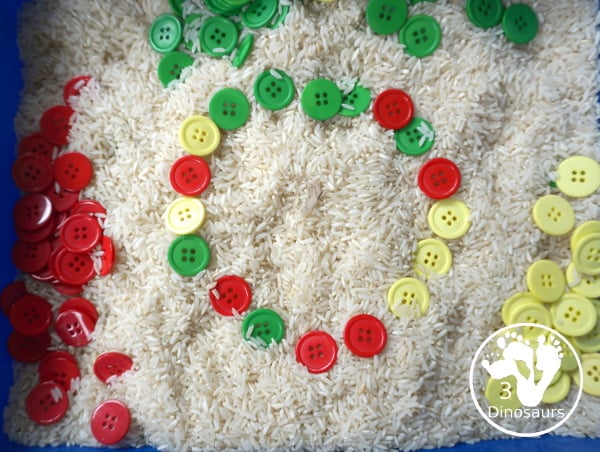 Red, Green & Yellow Button Sensory Bin. A fun button sensory bin that has the same color as apples. A fun fall sensory bin that is easy to set up and fun colors for kids. - 3Dinosaurs.com