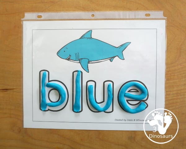 Free Shark Color Word Playdough Mat Printables - a shark in a single color with color word below. A fun shark theme for color word playdough mat for kids.- 3Dinosaurs.com