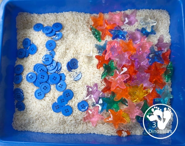 Starfish Sensory Bin - a simple starfish sensory bin for kids with starfish, blue buttons, and rice filler. A simple ocean sensory bin for kids. 3Dinosaurs.com