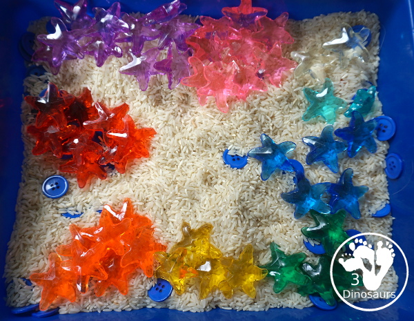 Starfish Sensory Bin - a simple starfish sensory bin for kids with starfish, blue buttons, and rice filler. A simple ocean sensory bin for kids. 3Dinosaurs.com