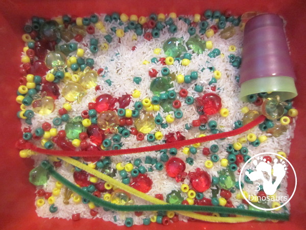 Apple Sensory Bin -  with apples, and pony beads with a colors red, green and yellow. A fun three color sensory bin for the colors of apples. 3Dinosaurs.com