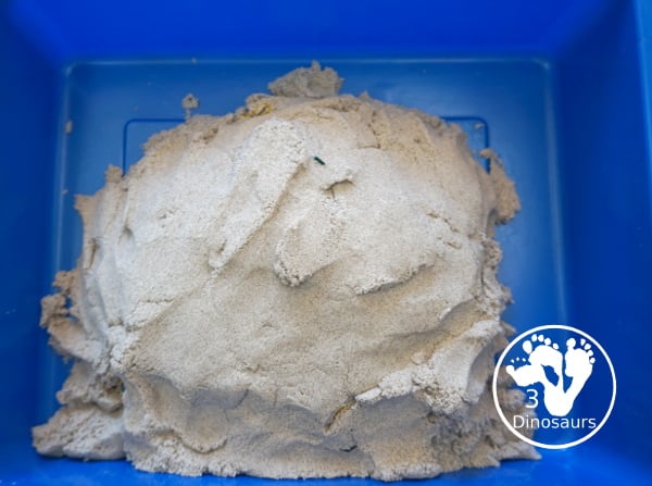 Pirate Treasure Kinetic Sensory Bin - a fun sensory bin for a pirate theme or talk like a pirate day. A fun way to dig and search and find treasure in the bin with gems, gold and kinetic sand. 3Dinosaurs.com