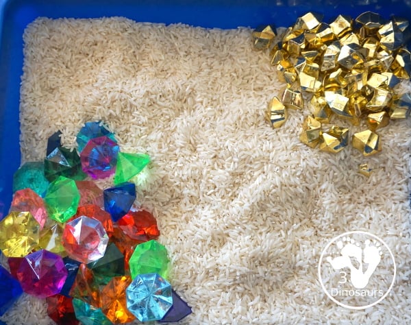 Pirate Treasure Rice Sensory Bin - a run sensory bin with gold rocks and colored gems with a rice filler for a Pirate theme that is great for Talk Like a Pirate Day or a summer pirate theme. - 3Dinosaurs.com