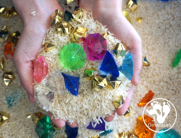 Pirate Treasure Rice Sensory Bin - a run sensory bin with gold rocks and colored gems with a rice filler for a Pirate theme that is great for Talk Like a Pirate Day or a summer pirate theme. - 3Dinosaurs.com